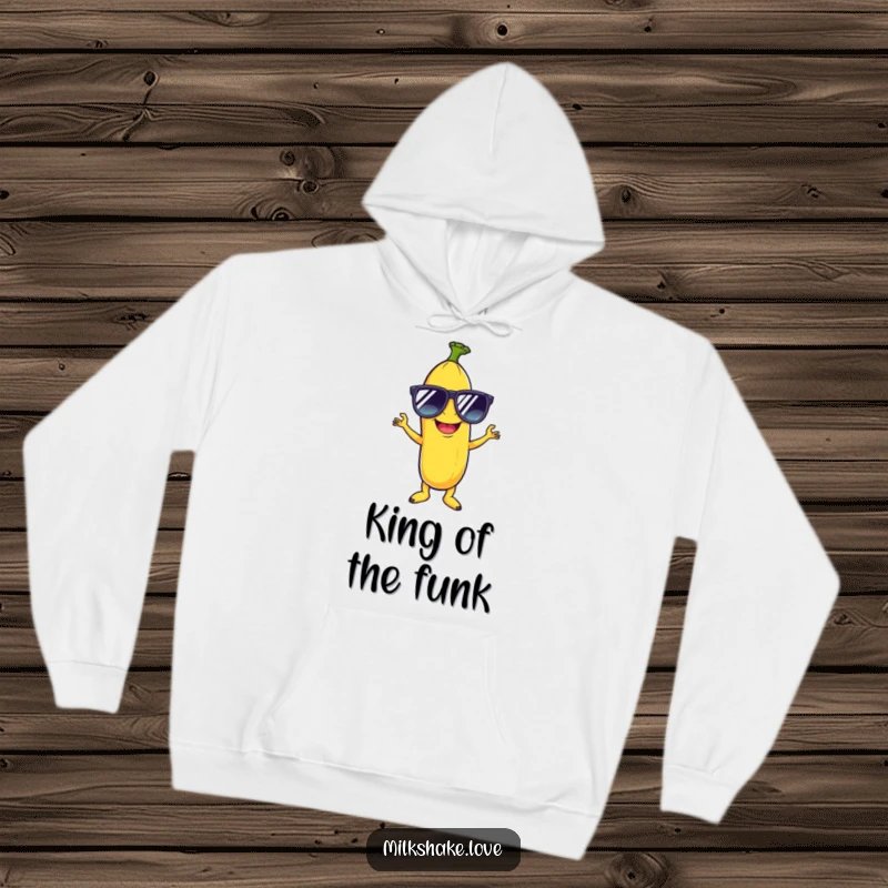 Funny hoodie featuring a giggling banana sporting oversized sunglasses, striking a flamboyant disco pose, perfect for cozy fun.