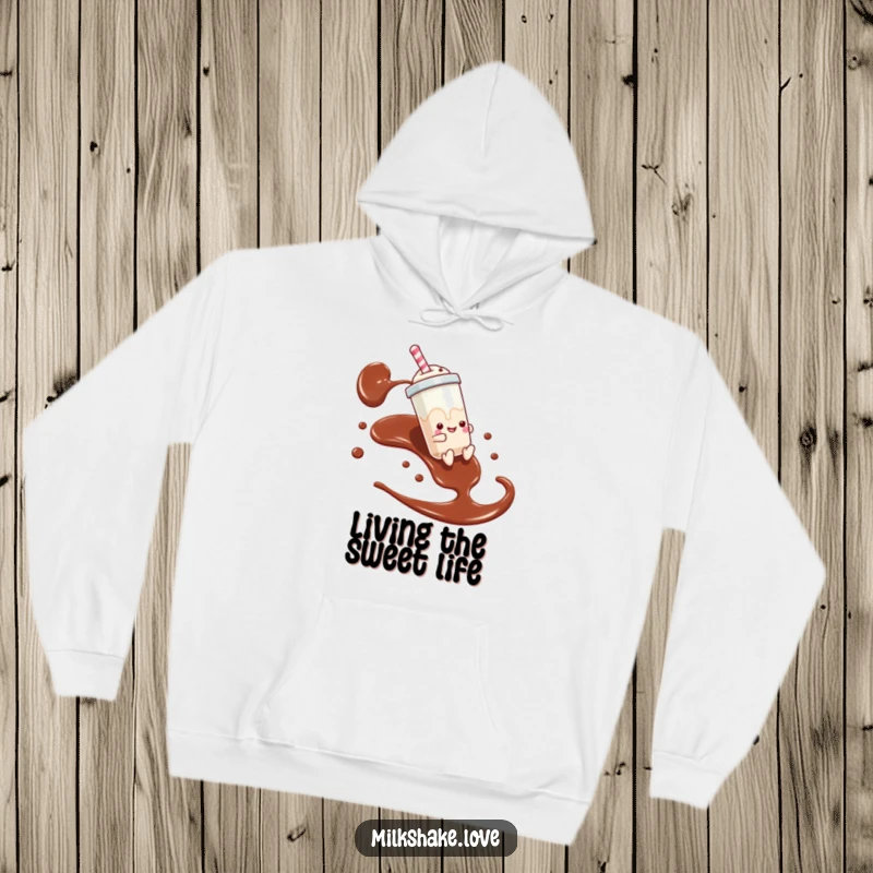 Funny hoodie featuring a milkshake character on a thrilling slide down chocolate syrup, offering cozy fun.