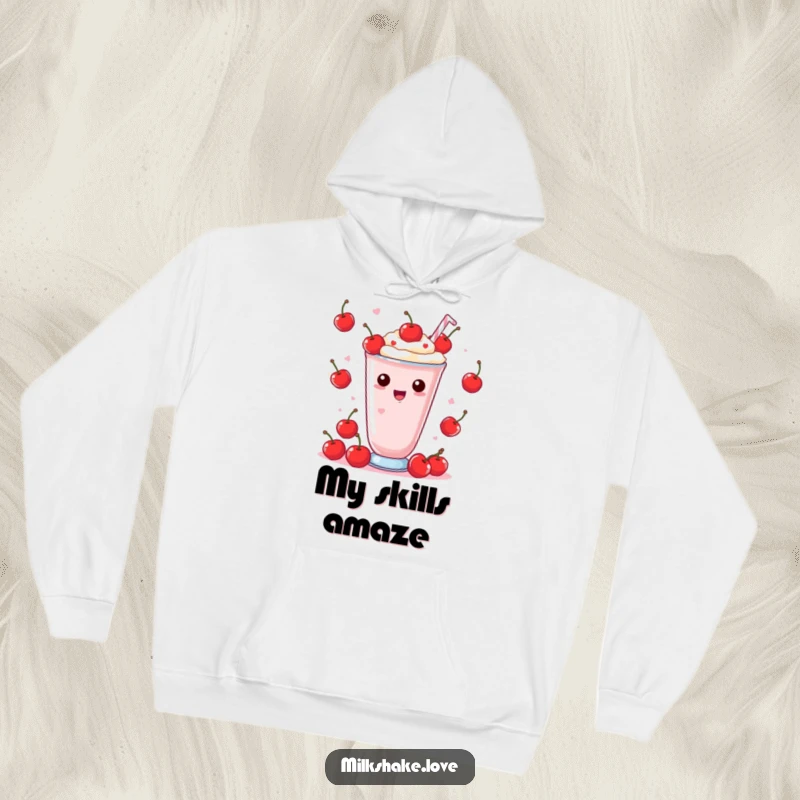 Funny Hoodie with a Kawaii milkshake in mid-juggle with tiny cherries, looking delighted and focused for a fun vibe.