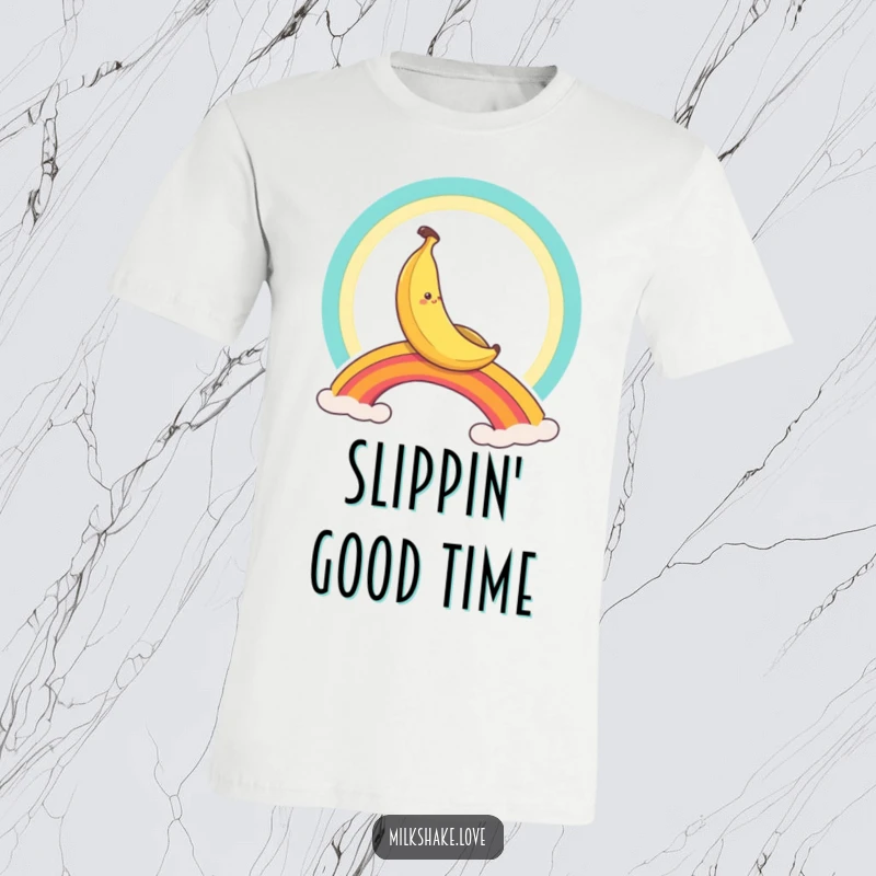Funny banana character gleefully slides down a bright rainbow, a humorous and eye-catching graphic tee.
